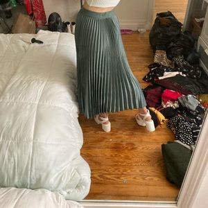 Pleated green midi skirt
